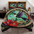 Purple wing hummingbird bedding with ornate gold oval and red flowers