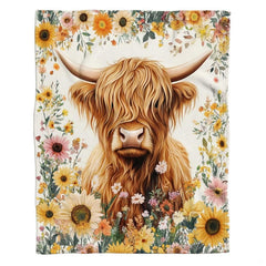 Close-up perspective of the Scottish highland cow face showing tousled ginger fur and sweeping horns