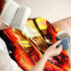 Overhead bedroom display of patriotic firefighter bedding featuring blazing orange flames and monochrome flag graphics.