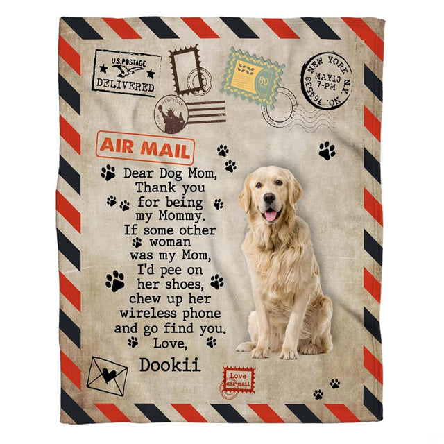 Close up of golden retriever bed styling showing antique parchment background and postal cancellation stamps.