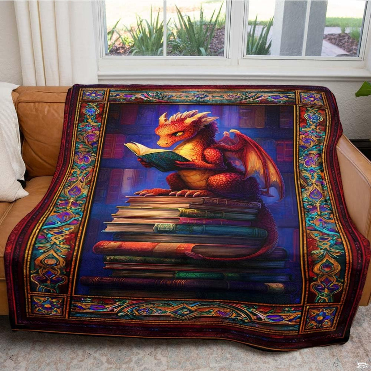 Overhead perspective of dragon fantasy books illustration showcased on styled bedding.
