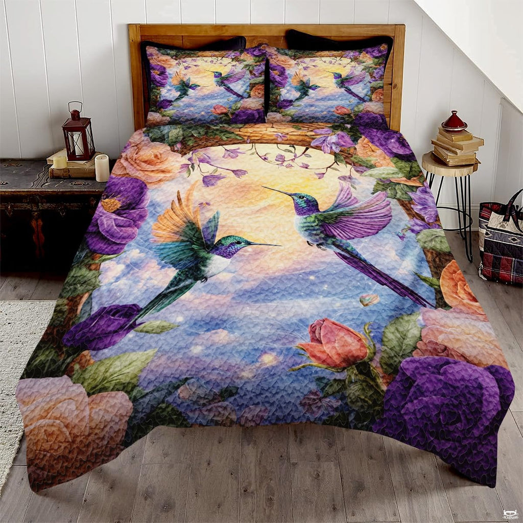 Two green purple hummingbirds flying among purple and peach roses