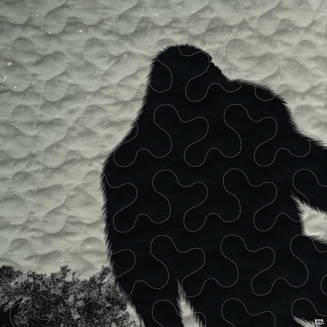 Close-up view of Bigfoot bedding highlighting detailed Sasquatch silhouette, full moon, and pines