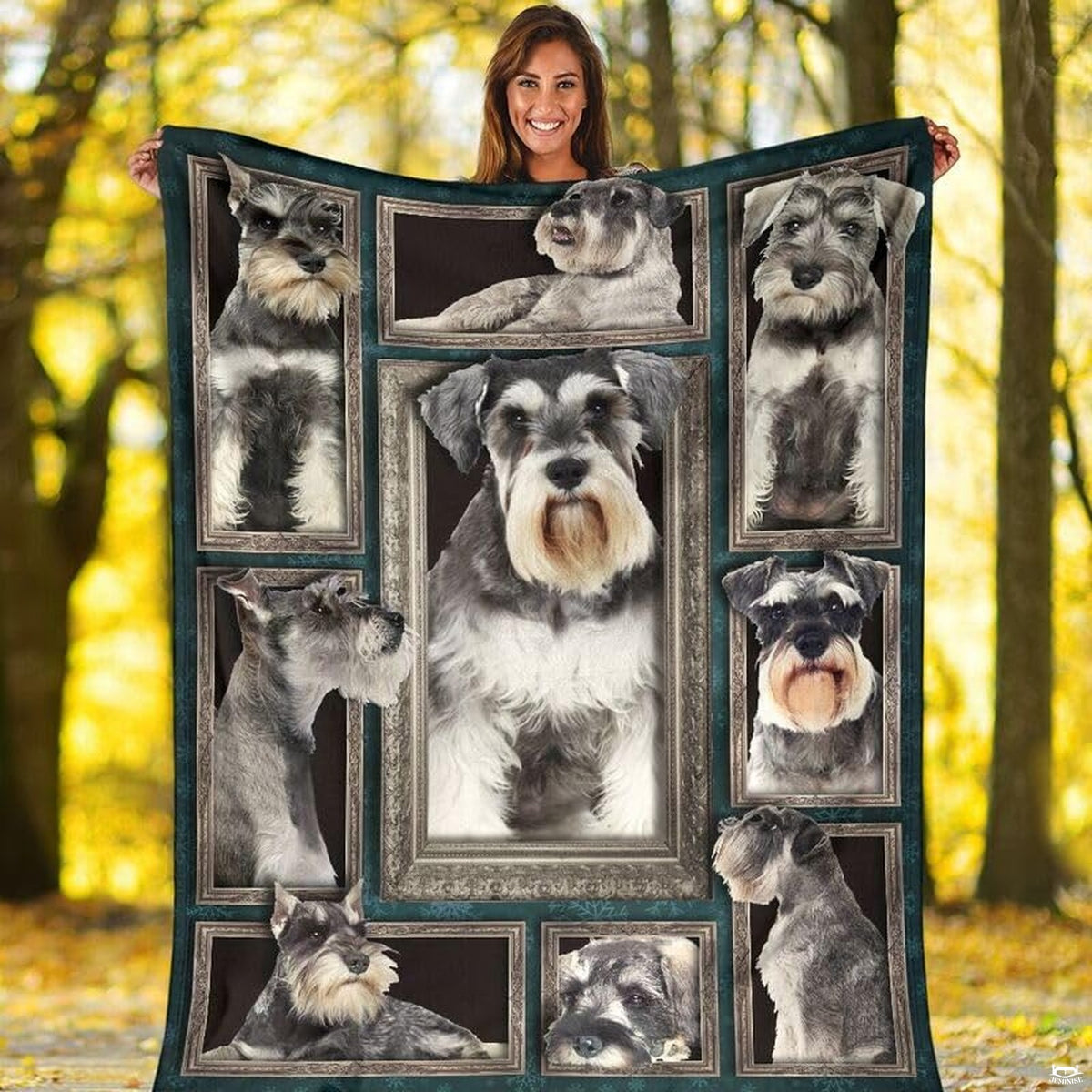 Outdoor view of a model holding up the full Miniature Schnauzer gallery throw blanket.