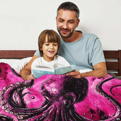 Cozy lifestyle setting with cosmic pink kraken octopus design draped across bed.