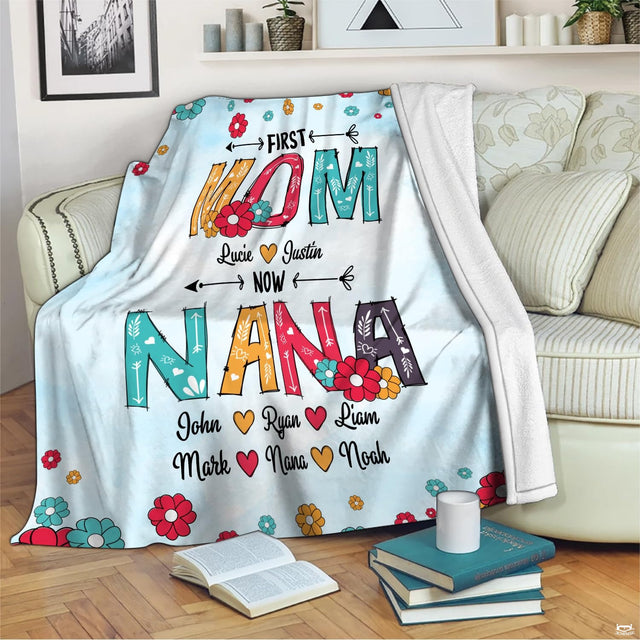 Close-up perspective of patterned Mom lettering decorated with floral clusters and whimsical arrow accents