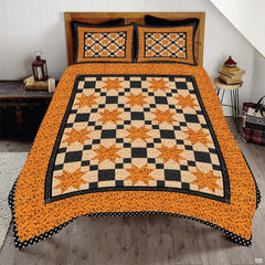 Autumn star patchwork bedding featuring orange geometric stars and black checkerboard squares