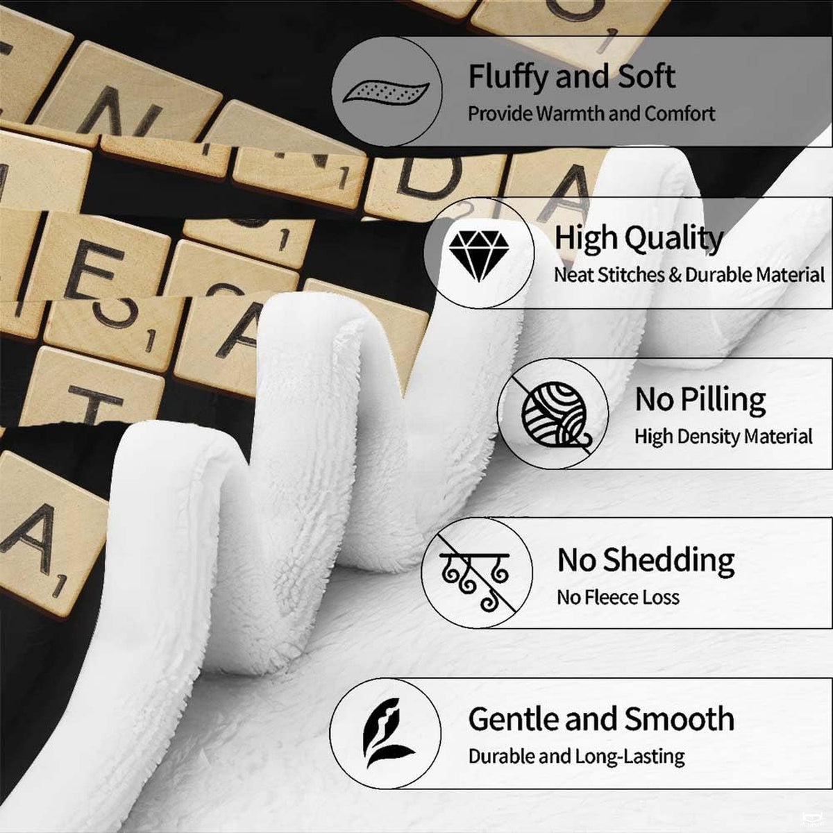 Folded display of black crossword tiles blanket showing detailed edge hem and clear graphic print.