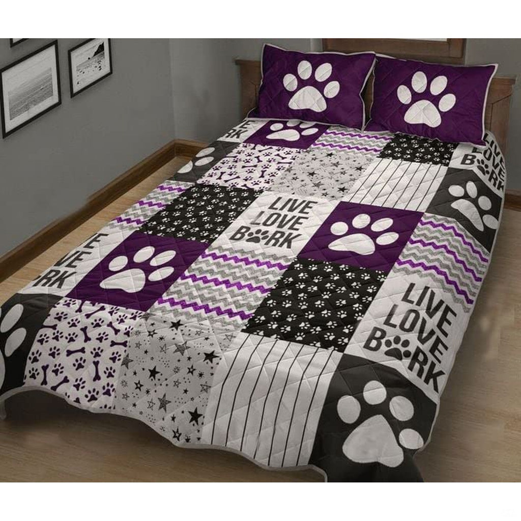 Purple dog bed style patchwork bedding set featuring paw prints and bone motifs in plum and charcoal.
