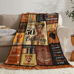Angle view of golden milestone throw blanket showing crisp edges and geometric tribal perimeter