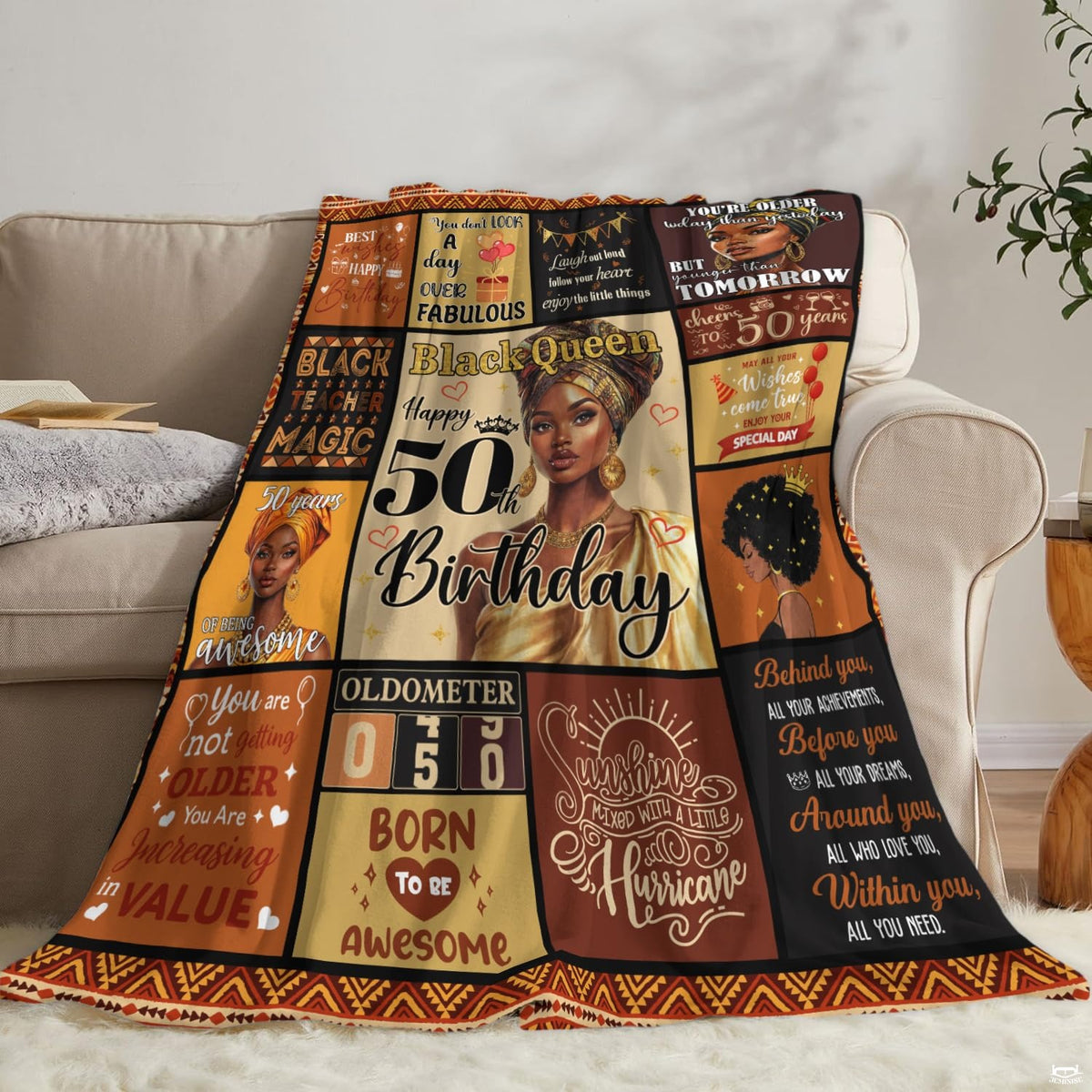 Angle view of golden milestone throw blanket showing crisp edges and geometric tribal perimeter