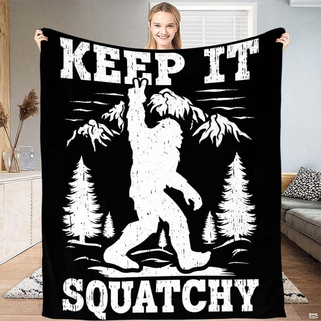 Distressed white Bigfoot flashing peace sign before mountain peaks and pines with slogan typography, view 1.