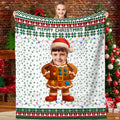 Gingerbread cookie character in Santa hat with Fair Isle snowflake borders on holiday throw blanket