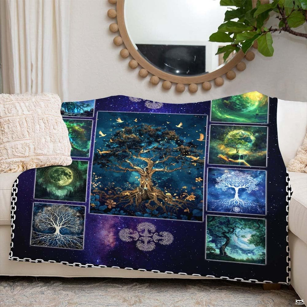 Detailed view of planetary orbs and moonlit forest vignettes on sacred tree collage throw blanket