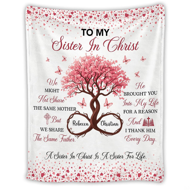 Close view of open Bible illustration with cross and intertwined floral wreath accents.