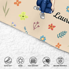 Lifestyle presentation of floral reader throw blanket styled in a cozy study lounge