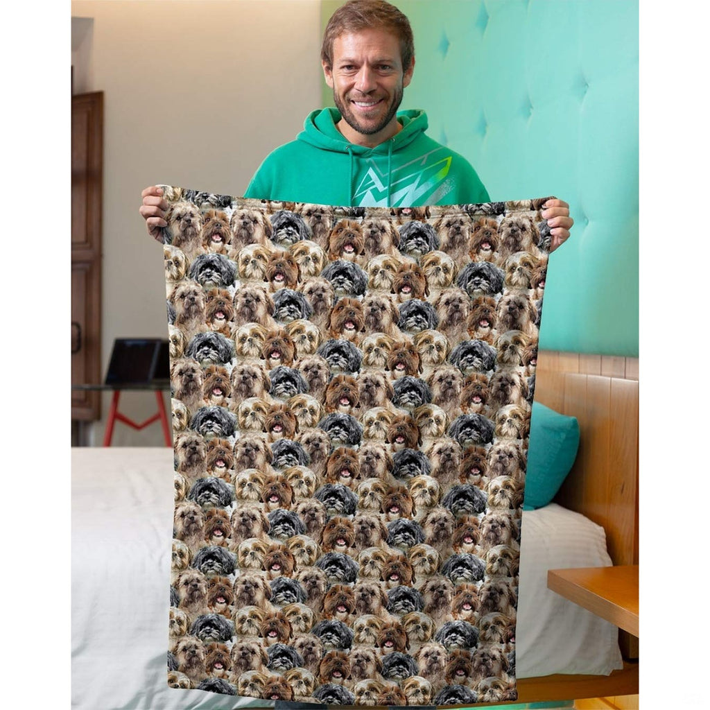 Model holding up a Shih Tzu dog collage blanket in an indoor bedroom setting.