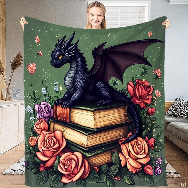 Fantasy dragon on books floral throw blanket showing mythical dragon perched on antique books and roses