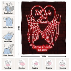 Red neon skeleton hands throw blanket draped over contemporary living room sofa