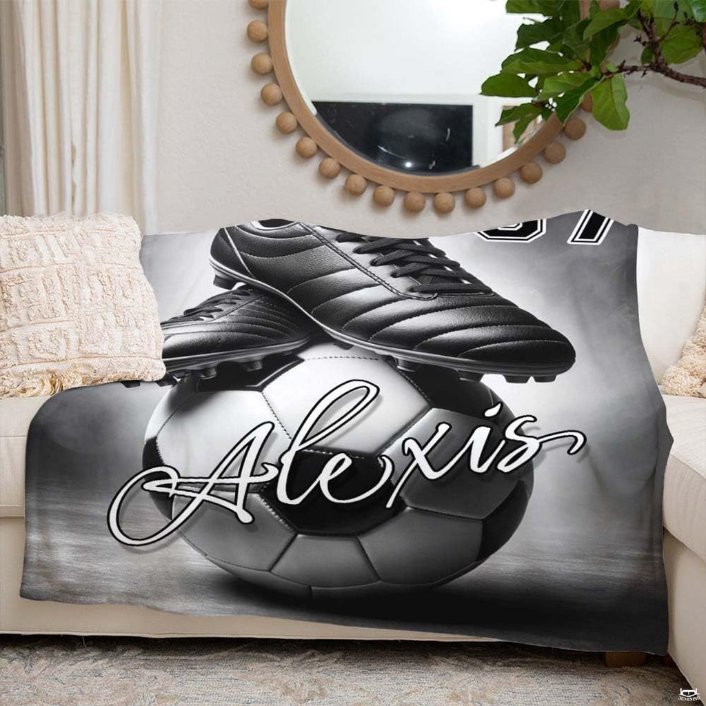 Black and white sporting artwork displayed across a stylish bedroom interior setting.