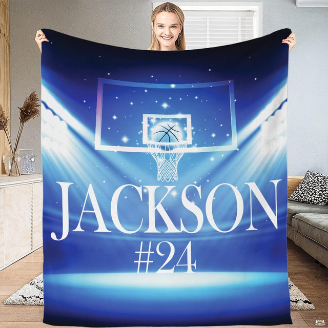Overhead view of basketball hoop artwork on royal blue and cyan court bedding decor.