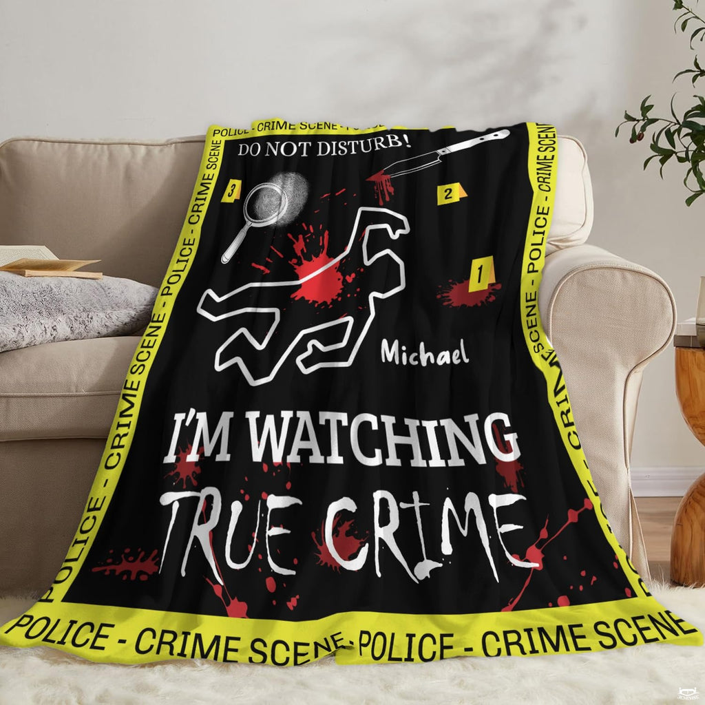 Crime scene throw blanket draped over living room sofa beneath round wall mirror