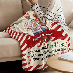 Holiday couple inside candy cane heart frame on diagonal peppermint stripes, view 4.