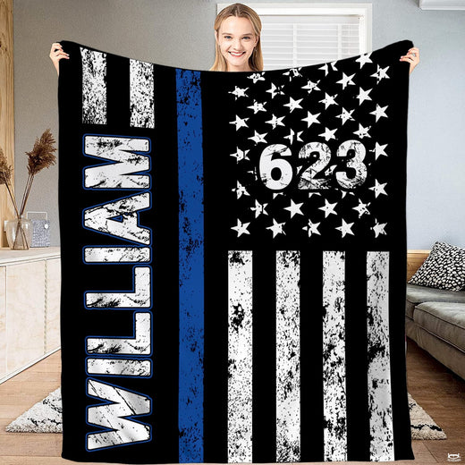 Thin striped bedding set showing distressed American flag graphic with vivid blue accent on black.