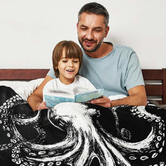 Cozy lifestyle setting with kraken octopus design draped across bed.