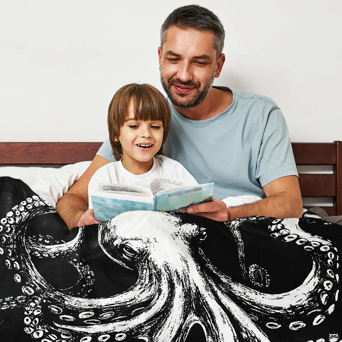 Cozy lifestyle setting with kraken octopus design draped across bed.