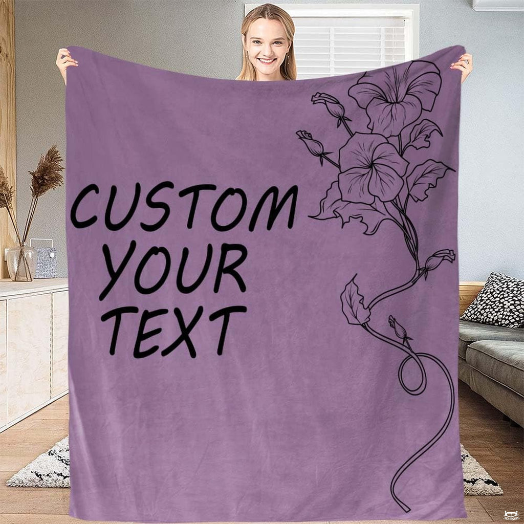 Close-up of the delicate morning glory floral line illustration, winding vine, and leaf details on a blanket