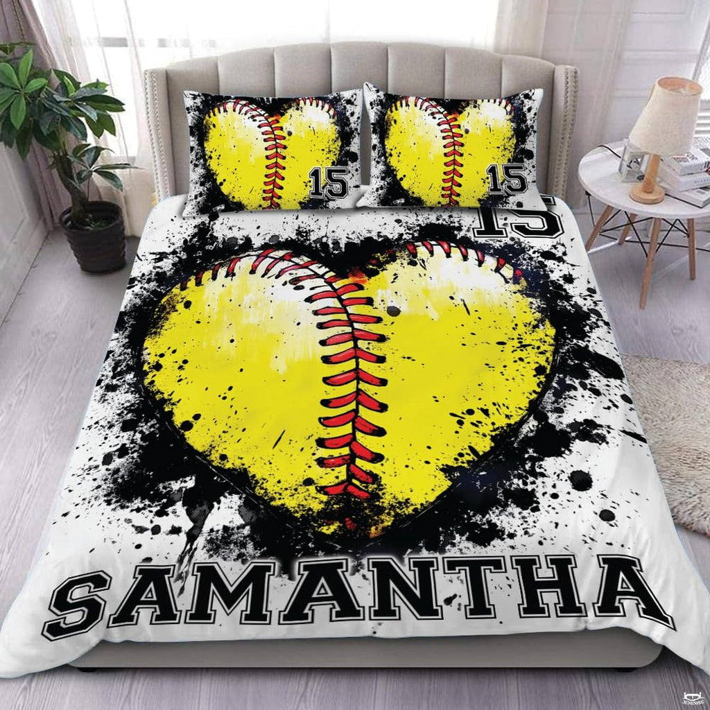 Softball heart sports bedding featuring optic yellow ball graphic and black ink splatters on white bed