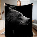 Black and white bear profile throw blanket featuring dramatic bear portrait emerging from shadows