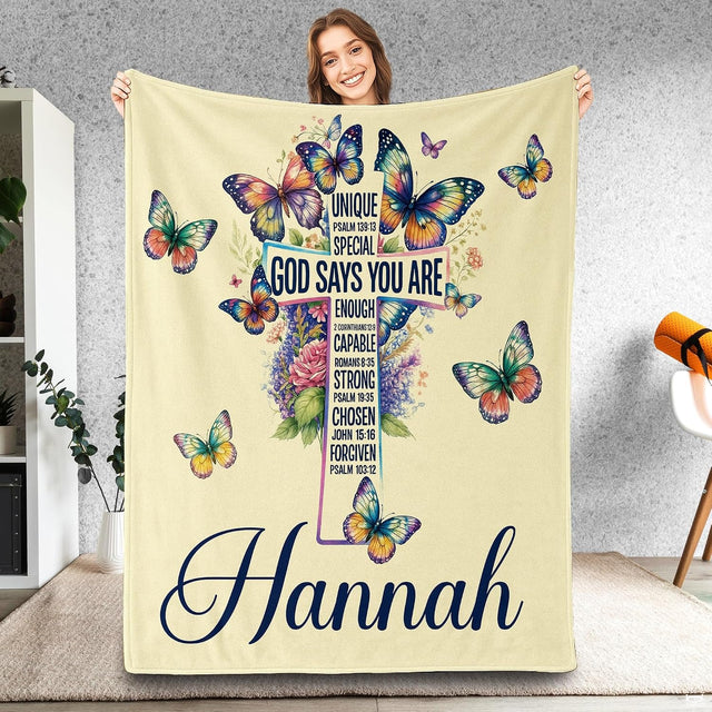 Whimsigoth bedding featuring an ornate floral cross with watercolor butterflies on light cream.
