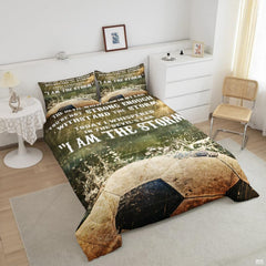 Close-up view of soccer bedding showcasing athletic cleats, soccer ball graphics, and olive green