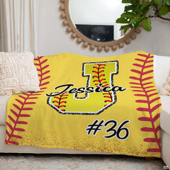 Yellow softball sports blanket spread smoothly across bedroom bed