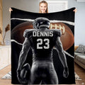 Torn paper football athlete gridiron art blanket held up by woman
