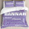 Lavender botanical typography word-cloud bedding set arranged in an airy bedroom setting.