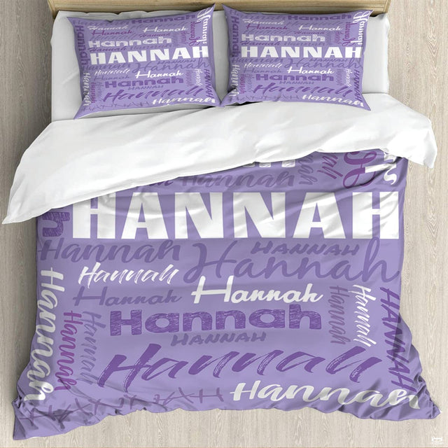 Lavender botanical typography word-cloud bedding set arranged in an airy bedroom setting.