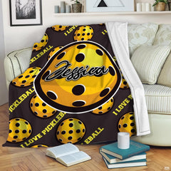 Yellow perforated pickleball pattern with central badge, view 1.