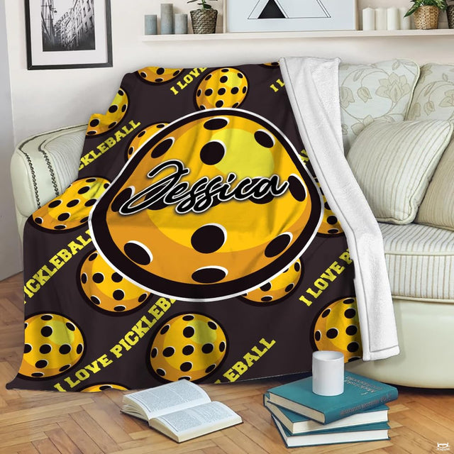 Yellow perforated pickleball pattern with central badge, view 1.