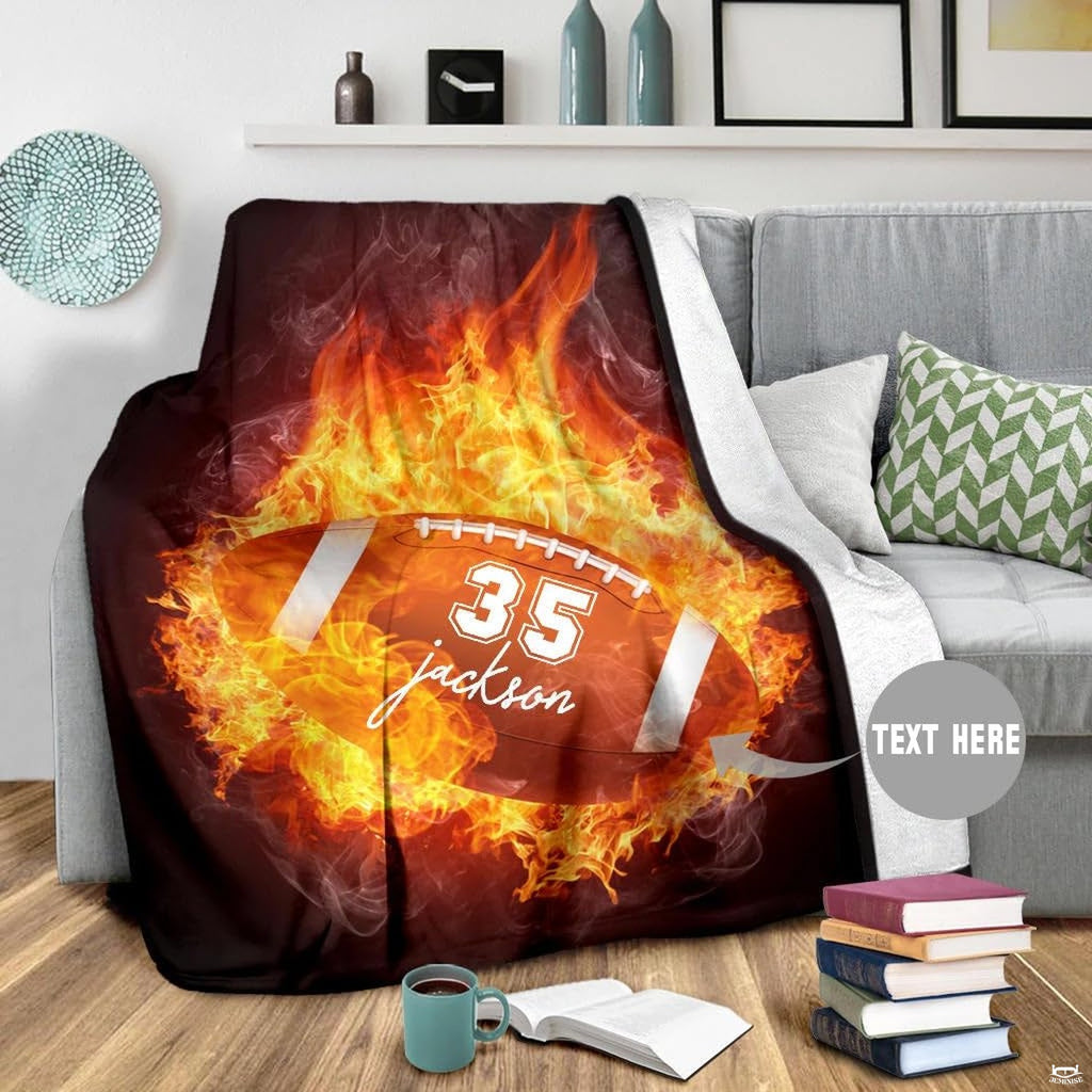 Close view of fiery flames and football laces on graphic blanket