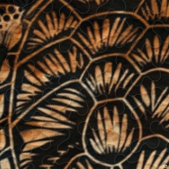 Close-up of golden tan batik sea turtle artwork with tropical leaves and vermicelli stippled texture.