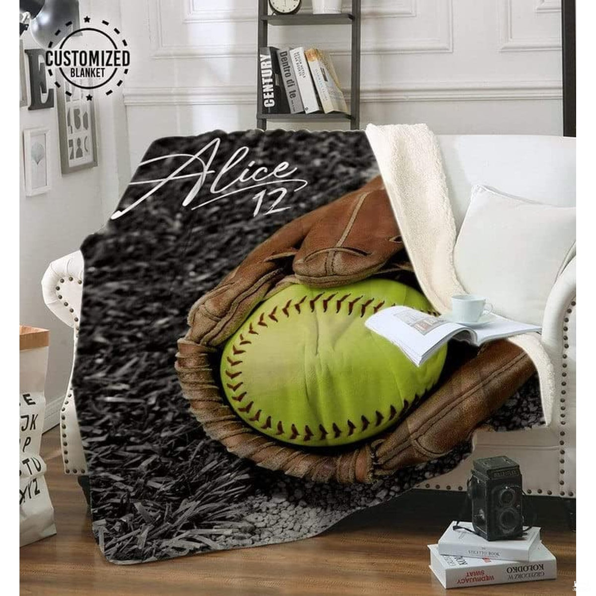 Softball infield graphic throw blanket draped neatly across a white living room armchair.