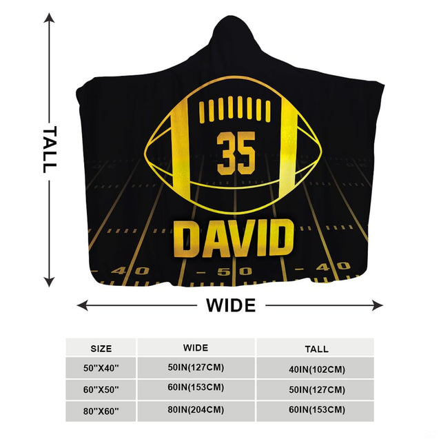 Black and gold football throw blanket held open showing high contrast stadium graphic
