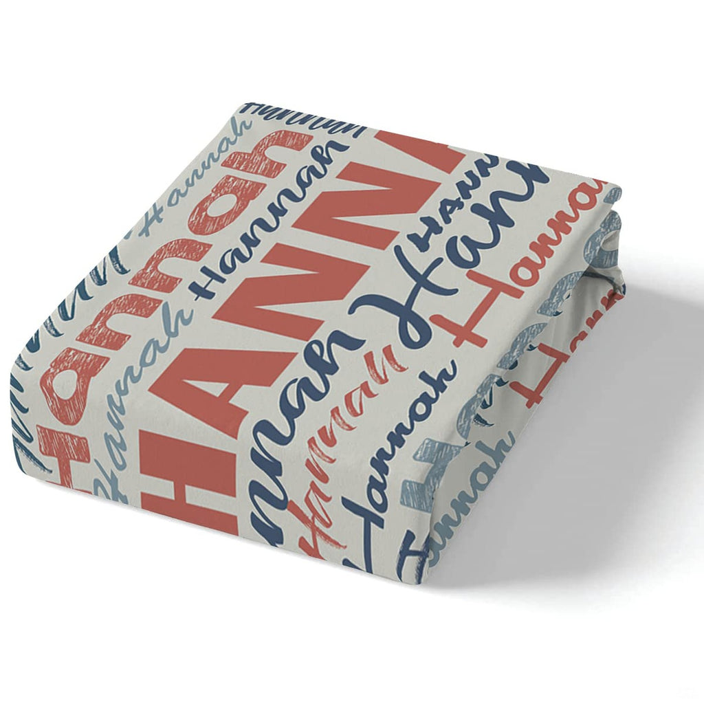 Overhead perspective of multi-directional typographic collage motif with coral red and navy tones.