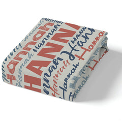 Overhead perspective of multi-directional typographic collage motif with coral red and navy tones.