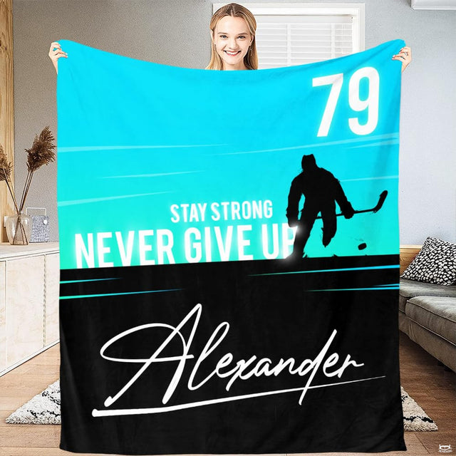 Split cyan and black sports bedding featuring a charging ice hockey player silhouette.