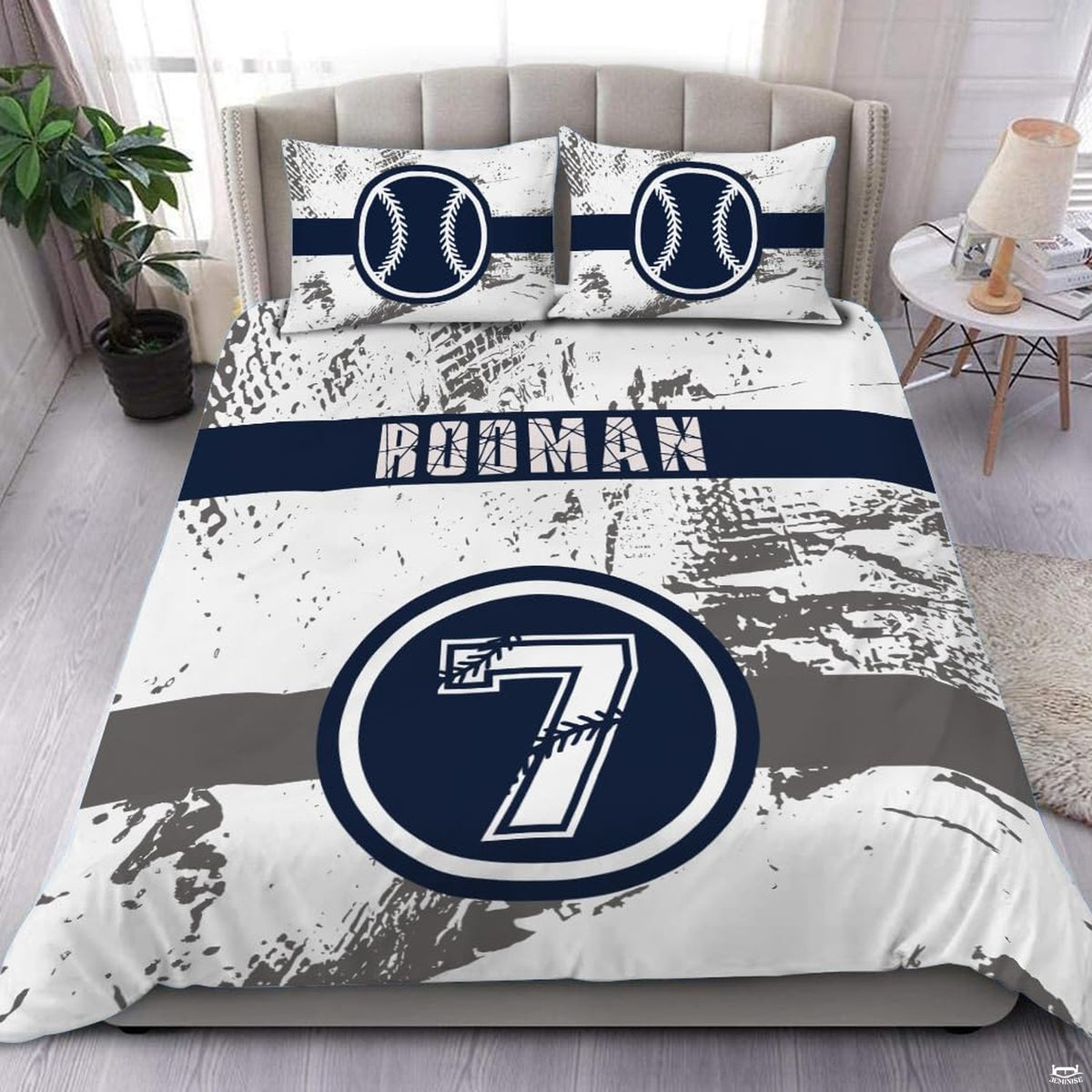 White and forest green baseball athletic sports bedding set displayed on a bed in a modern room