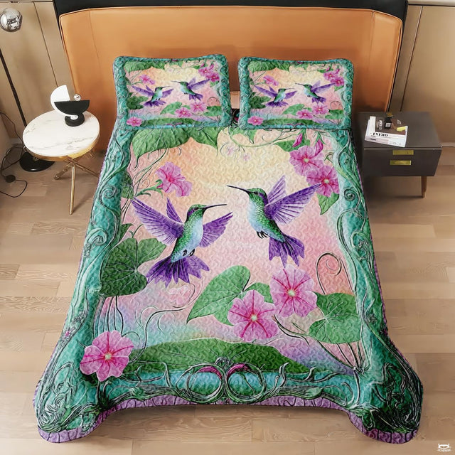 Overhead view of paired hummingbirds in a pink and teal garden design